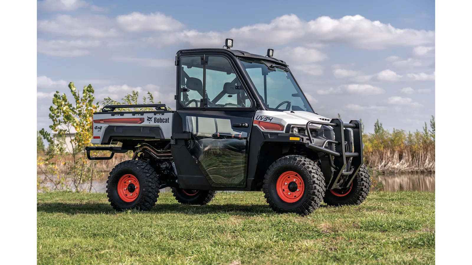Bobcat UV34 utility vehicle traveling on an off-road trail